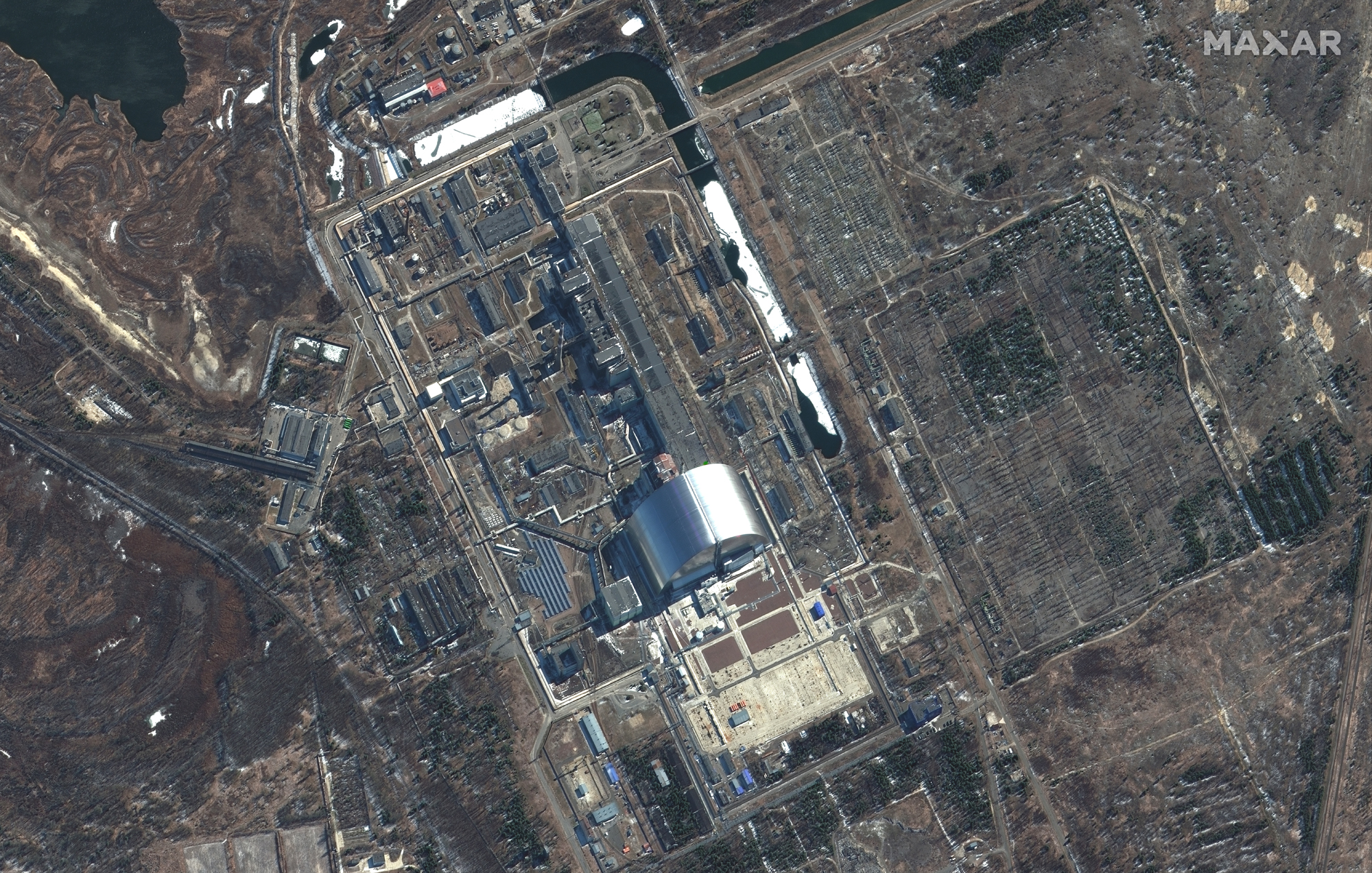 An overview of the sarcophagus covering the Chernobyl nuclear power plant in Ukraine and its surrounding area as seen by Maxar satellites on March 10, 2022.