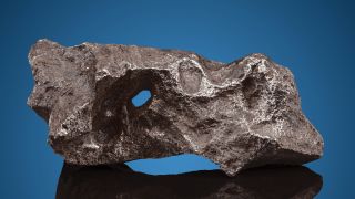 a grey-silver porous rock